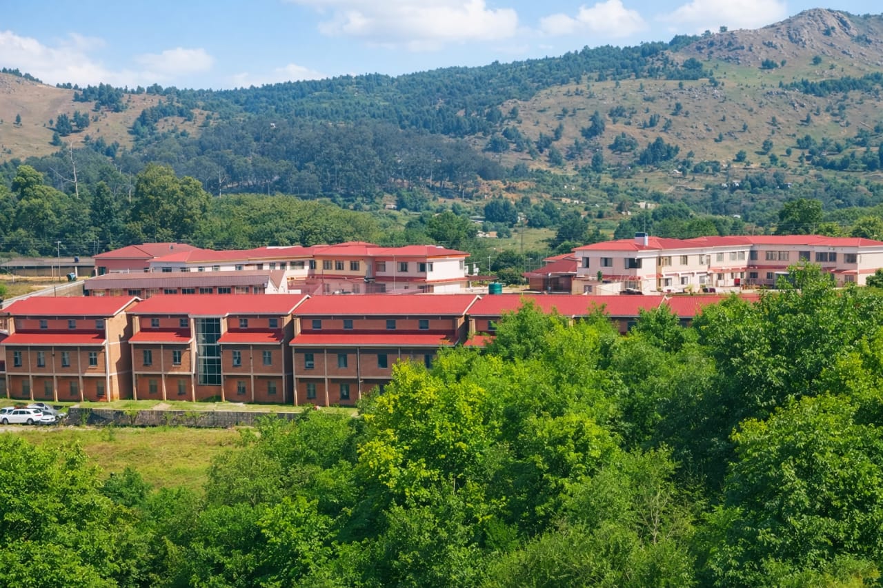 Aerial view of ECOT residence blocks against the mountains